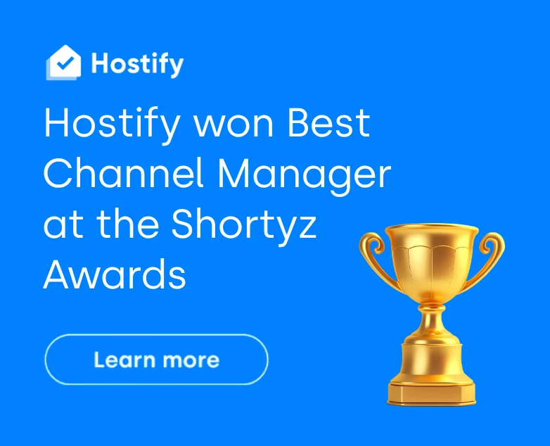 Hostify won Best Channel Manager award at Shortyz Awards, shown with gold trophy on blue background