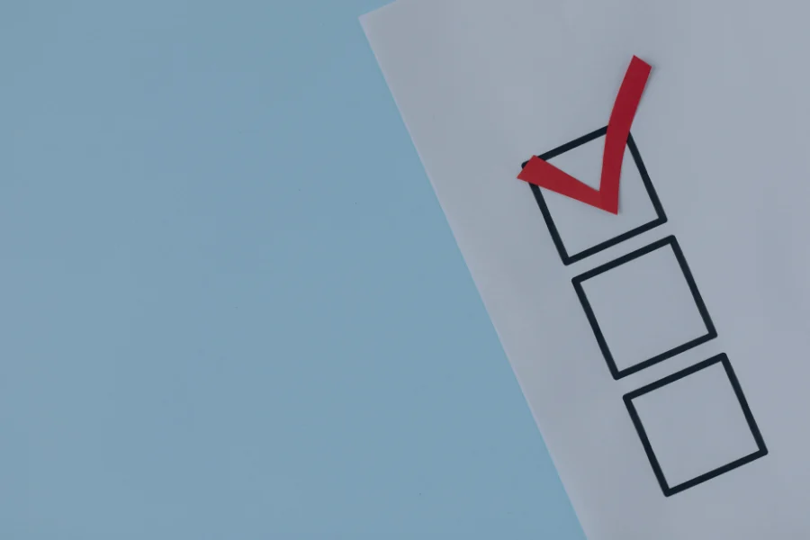 Checklist with red tick mark in top box and two empty boxes below