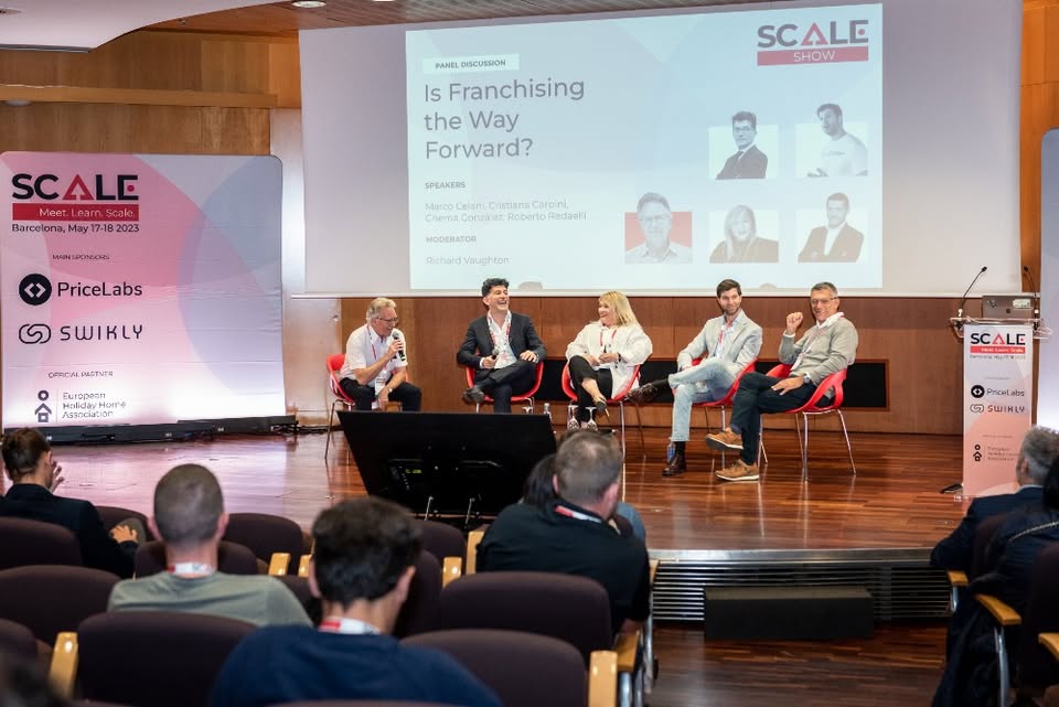 Panel discussion at SCALE Central & Eastern Europe 2026 conference with short-term rental industry professionals on stage