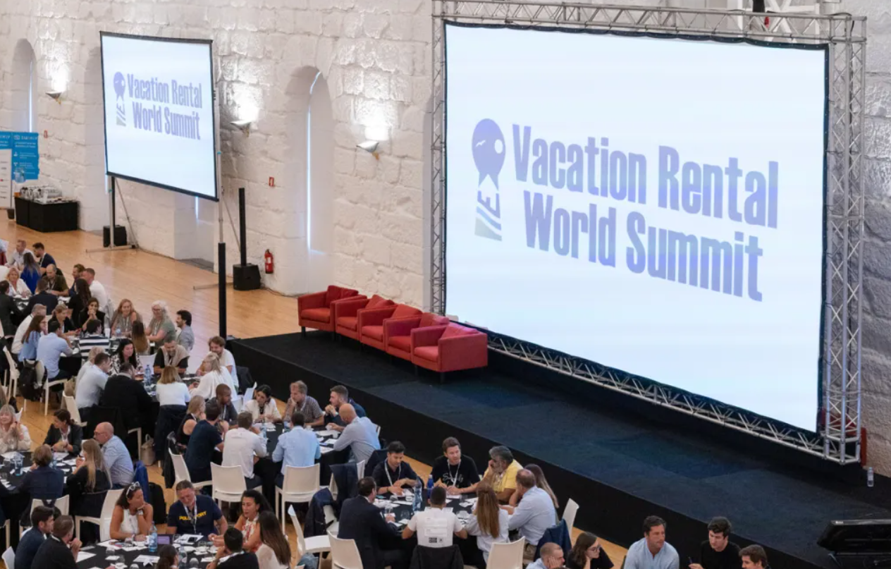 Vacation Rental World Summit 2026 conference presentation to assembled property managers and hospitality professionals