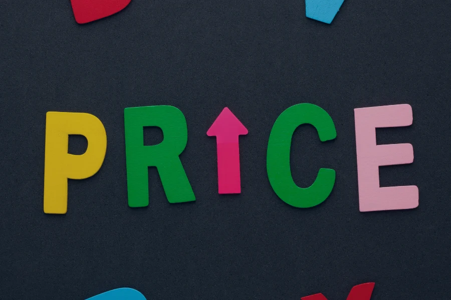 Colourful 3D letters spelling PRICE with an upward arrow on dark background, representing revenue growth and pricing strategy
