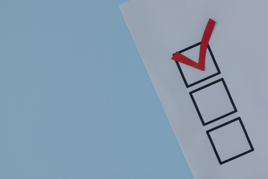 Checklist with red tick mark in top box and two empty boxes below
