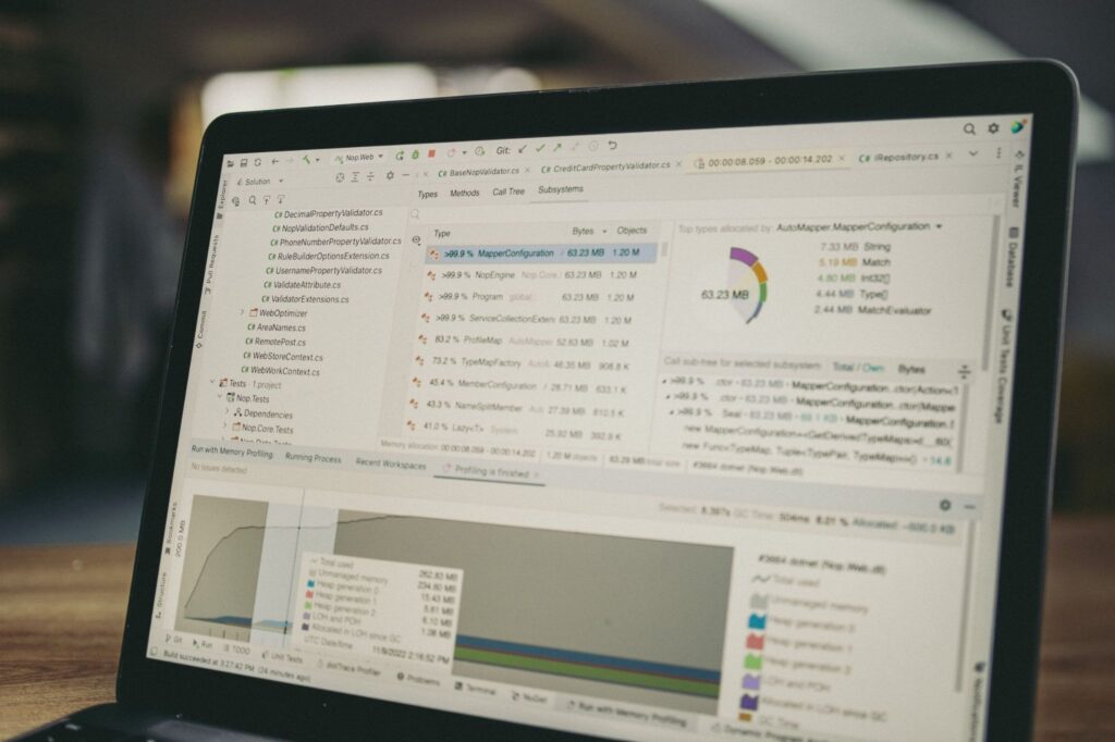 Developer analyzing code profiling data and memory allocation metrics in Visual Studio IDE