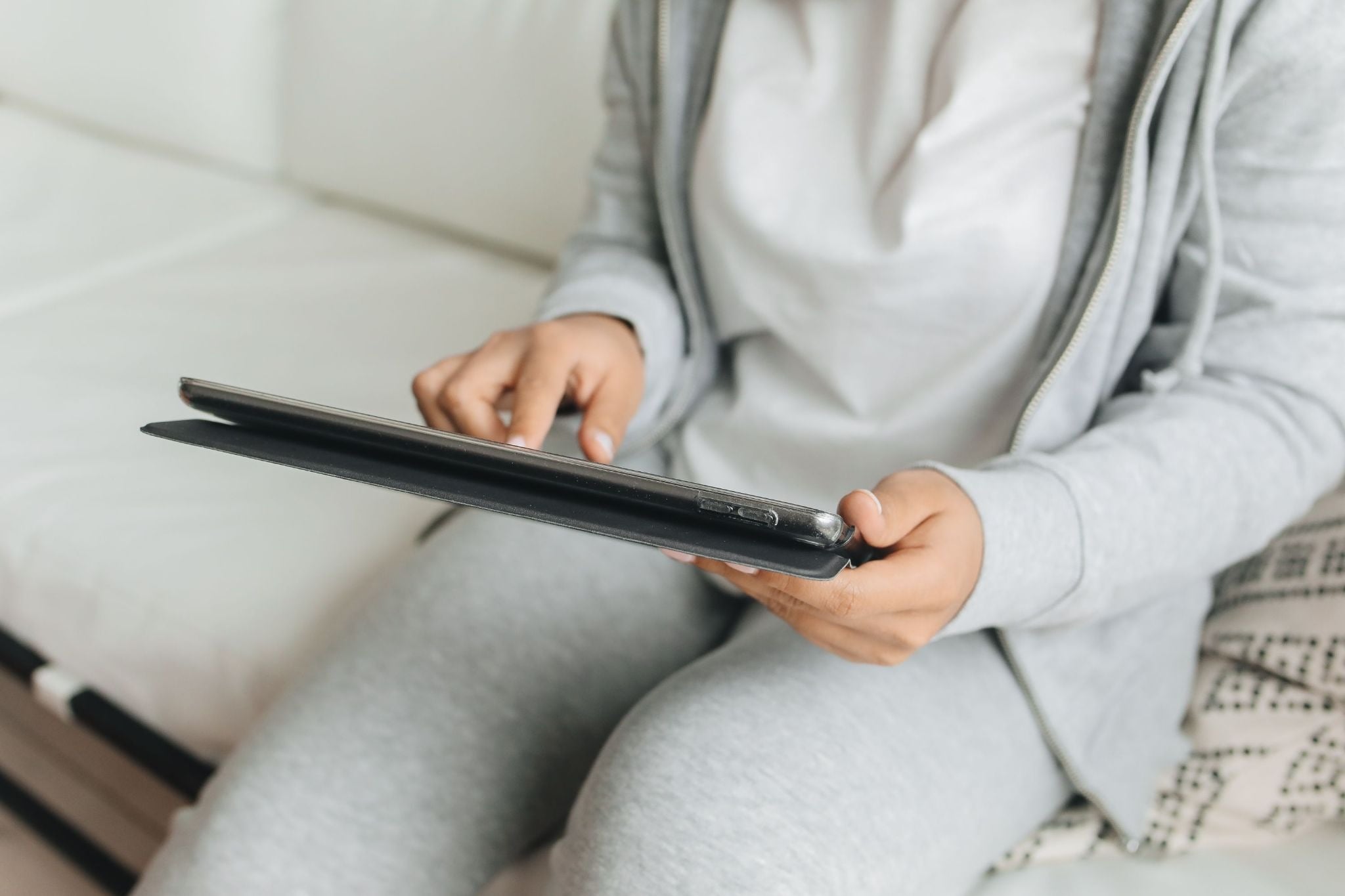 Property manager using tablet to manage vacation rental bookings and operations